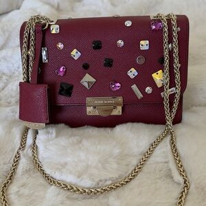 Embellished Burgundy Leather Shoulder Bag by HENRI BENDEL NEW YORK